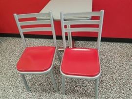 Lot (2) metal framed chairs with green seat