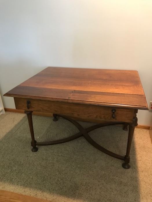 Beautiful, antique oak table with unique leaf extension in drawer. 