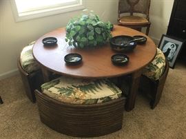 Teak table and wedge-shaped seats from Thailand. Adjustable height table.
