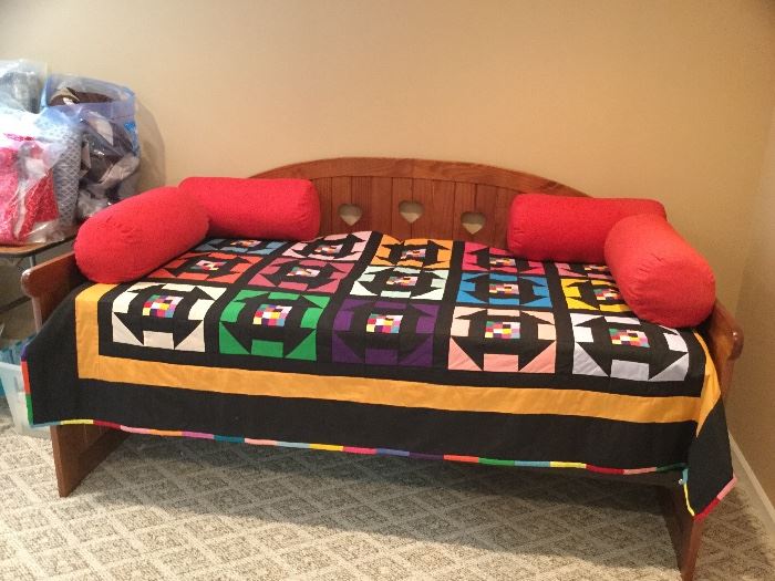 Twin size daybed with handmade twin block quilt