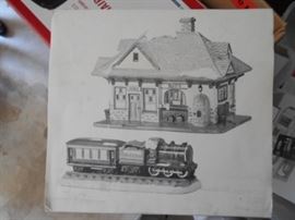 There are several village pieces from the Department 56 "Snow Village" Collection