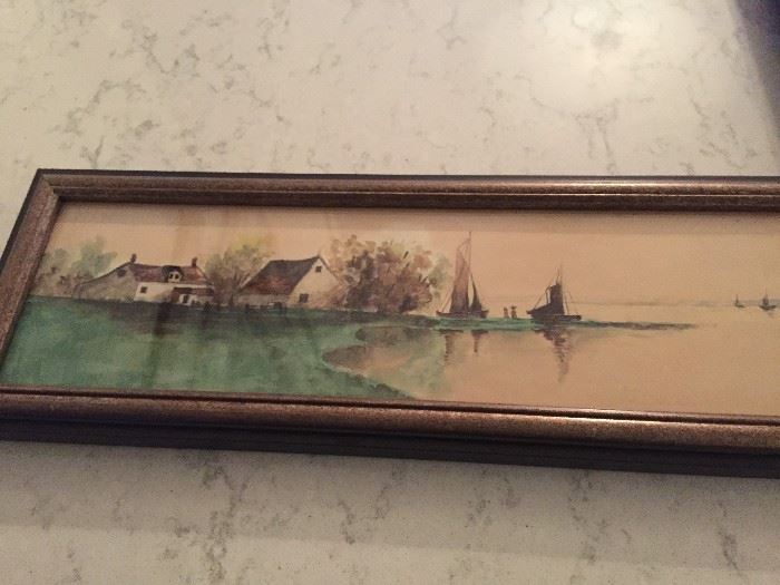 Framed water color of houses and sailboats