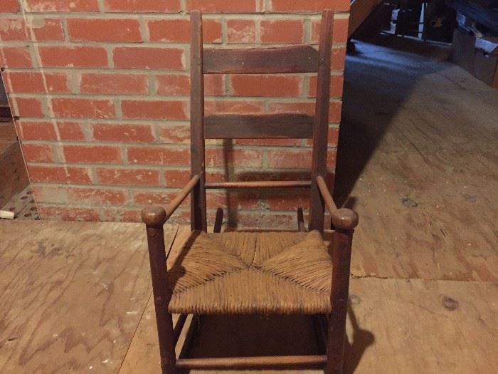 Child's antique rocker with rush seat.