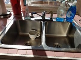 Double sink with Badger garbage disposal.