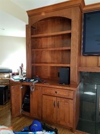 Large built-in cherry wood entertainment center.  Cabinetry and doors 