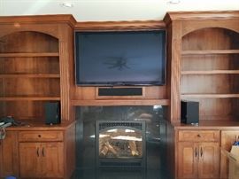 Large built-in cherry wood entertainment center.  Cabinetry and doors .  TELEVISION NOT INCLUDED