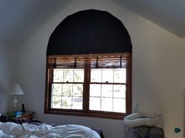Master bed large window with arch