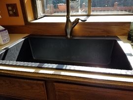 Deep "farm" sink.  Think it is acrylic or fiberglass.