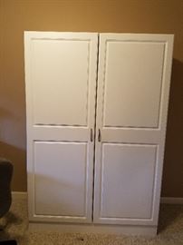 Tall white cabinet with shelves