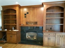 Large built-in cherry wood entertainment center.  Cabinetry and doors 