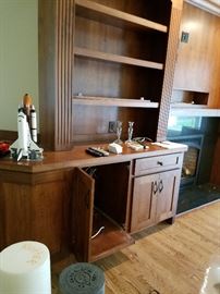 Large built-in cherry wood entertainment center.  Cabinetry and doors 