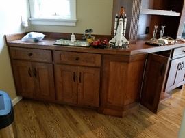 Large built-in cherry wood entertainment center.  Cabinetry and doors 