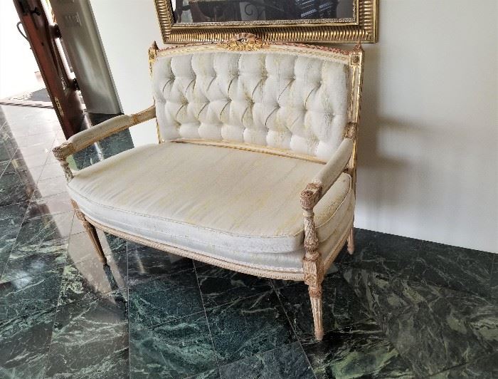 Authentic antique Louis XVI settee with very minimal wear for its age. We have two!