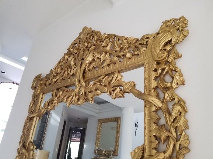 We have two of these beautiful antique carved wood mirrors