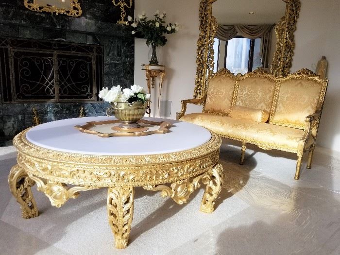 This incredible antique piece (French) began life as a European height coffee table. Painted in gold leaf, the original red marble slab and base are available as well. 