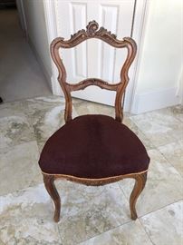 Antique chair with carved wood scrolls ($380)