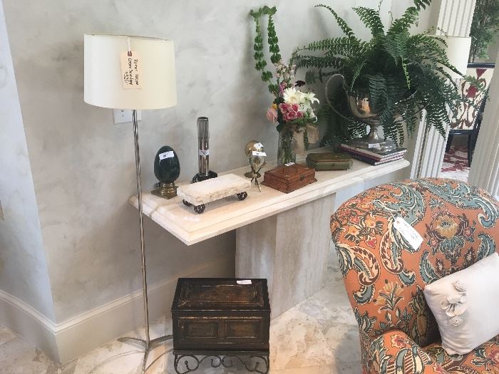 Palmer Hargrave lamps ($320/each-2 available); Travertine console table ($795); wooden box on stand ($48); assorted home decor items; silk plant; floral arrangement