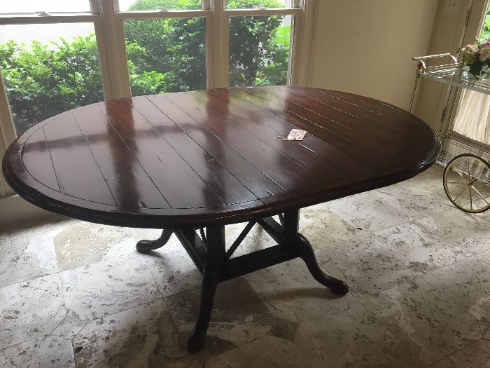Wood Breakfast table with leaf from ADAC ($895); table measures 52" in diameter when in round configuration and 72" by 52" with leaf in it