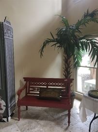Red bench ($188); faux palm tree in wooden planter ($120)