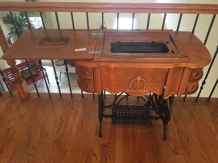 Antique sewing table with working cast iron pedal