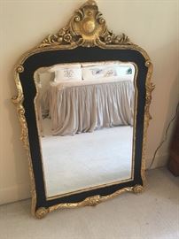 Hanging mirror with black and gilt accents ($245)