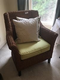 Woven chair with green cushion ($240)