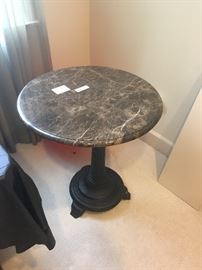 Marble topped round table with cast iron base ($88)