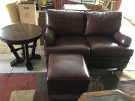 Leather Ethan Allen Love seat and ottoman. Purchased 2015. Paid $2,600.00 for love seat