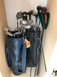 Older golf club and many golf balls still in original sleeves