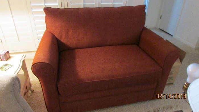 This is a twin size sleeper love seat