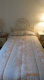 Twin beds with brass headboards