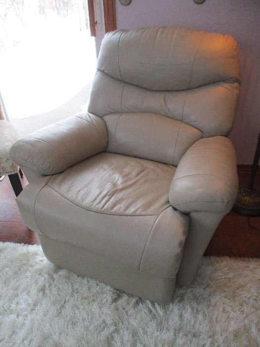 There are two leather recliners