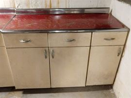LOVELY set of 1950's aluminum kitchen cabinets, upper and lower units.                                                                                   This couple NEVER threw anything away, just ask us about the 30 yard dumpster we filled up, in ONE day, at this house...