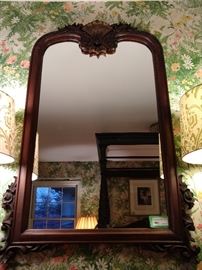 Antique mahogany, well-carved wall mirror. It was over the bed, but I moved it to the wall, to save face for the family.
