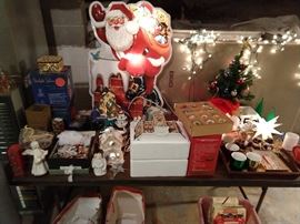 Like almost every house we host, there's always a Christmas Hell area. This time, it's in the basement.                                                                        We dolled this one up, lit up all the village people, Santas and tree lights.                                                                                      The lights scare away all the rats and roaches...