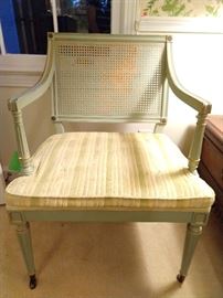 MCM French provincial upholstered/cane armchair in luscious pistachio green, with gold accents, casters.