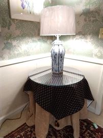 If we only knew how many of these skirted side tables, made of interlocking sawdust boards, then covered with extravagantly expensive fabric, tassels and topped with custom cut glass. Well, here's another one for you! Lovely Surya blue/white porcelain table lamp, with new shade and finial.