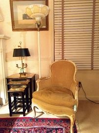 Vintage French bergere armchair, with a set of Asian nesting tables, vintage torchiere floor lamp and vintage 2-light French bouillotte table lamp