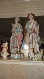 CLOSEUP OF BISQUE FIGURINES.