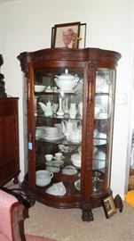 1890 OAK BOWFRONT WITH NORTH WIND DETAIL AND CLAW FEET. COLLECTION OF IRONSTONE.