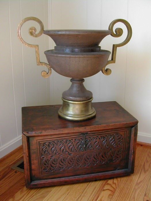 Solid bronze & iron urn. New, antiqued look. Underneath a handvarved antique chest (restored by expert).