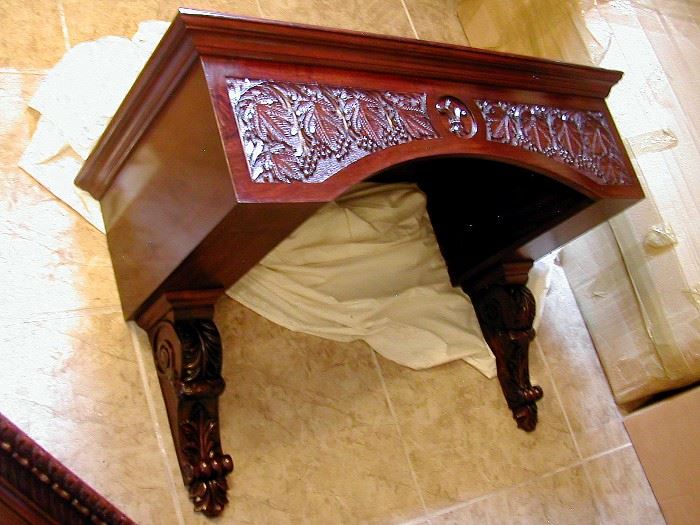 Unique over the stove hood. Solid rosewood, handcarved with 2 handcarved corbels.
