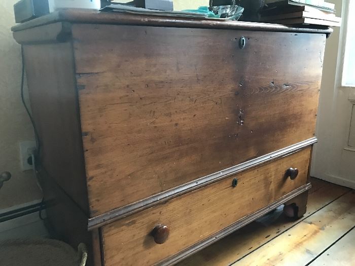 Top loading antique chest with lower drawer