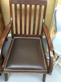 Antique nailhead detailed upholstered chair