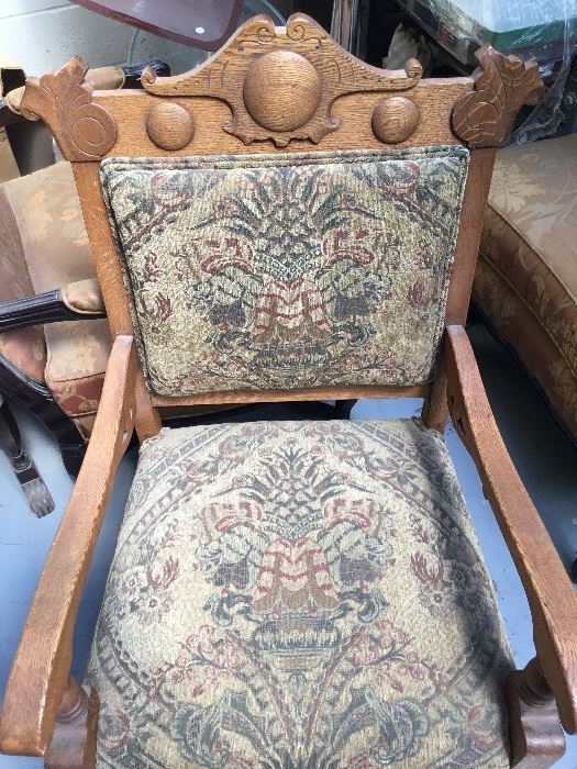Antique newly upholstered carved arm chair