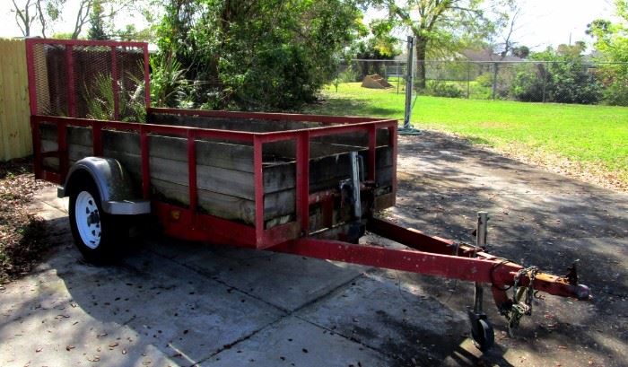 Utility Trailer with motor cycle wheel  bracket  mounted in front center of trailer bed