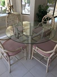 Lovely kitchen table with 4 padded chairs, glass top approx 48 in round