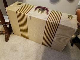 One several Vintage Suitcases