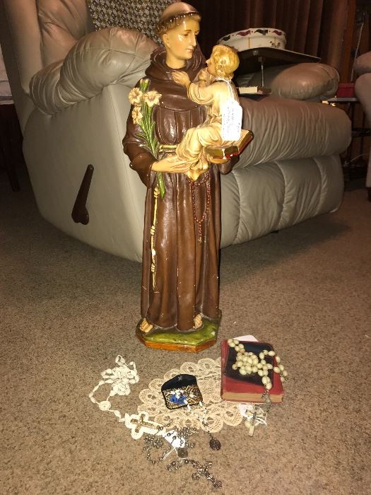 St. Francis of Assisi statue and lots of beautiful rosaries. 