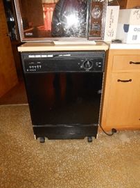 Roll about dishwasher with mock butcher block top.